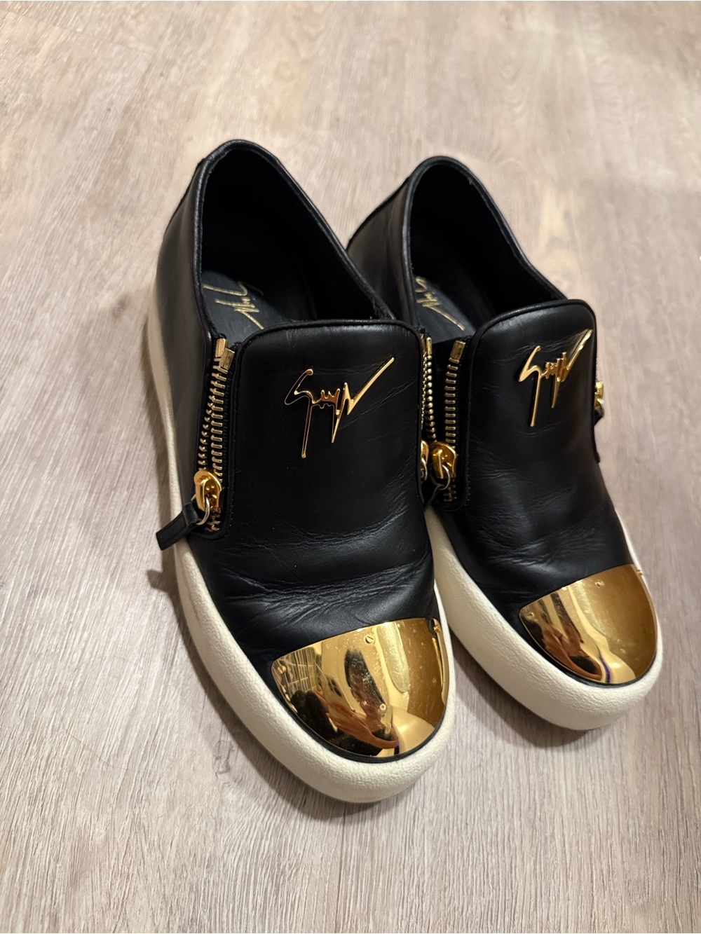 Giuseppe Zanotti Black Leather Slip-Ons with Gold Toe Cap and Zipper Detail